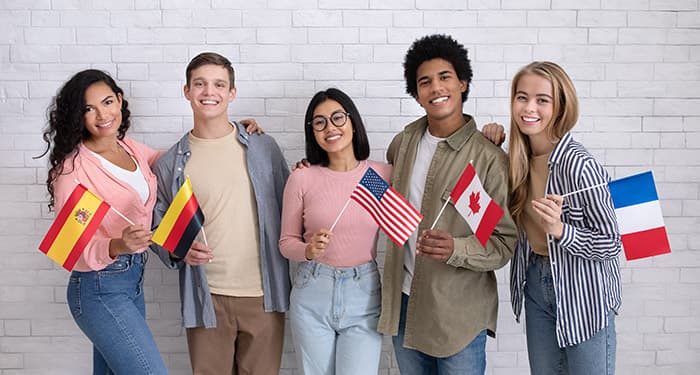 Students holding flags from various countries to illustrate images